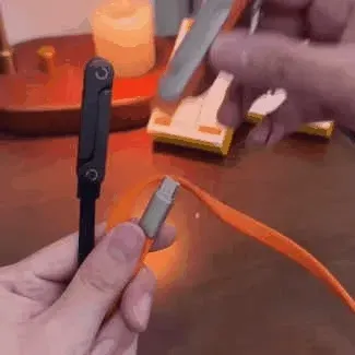 Orange right-angle USB-C adapter for comfortable charging and hands-free viewing